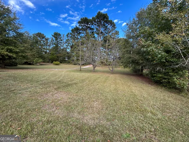 a view of a field with an outdoor space