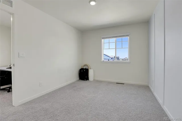 a bathroom with a shower and a sink