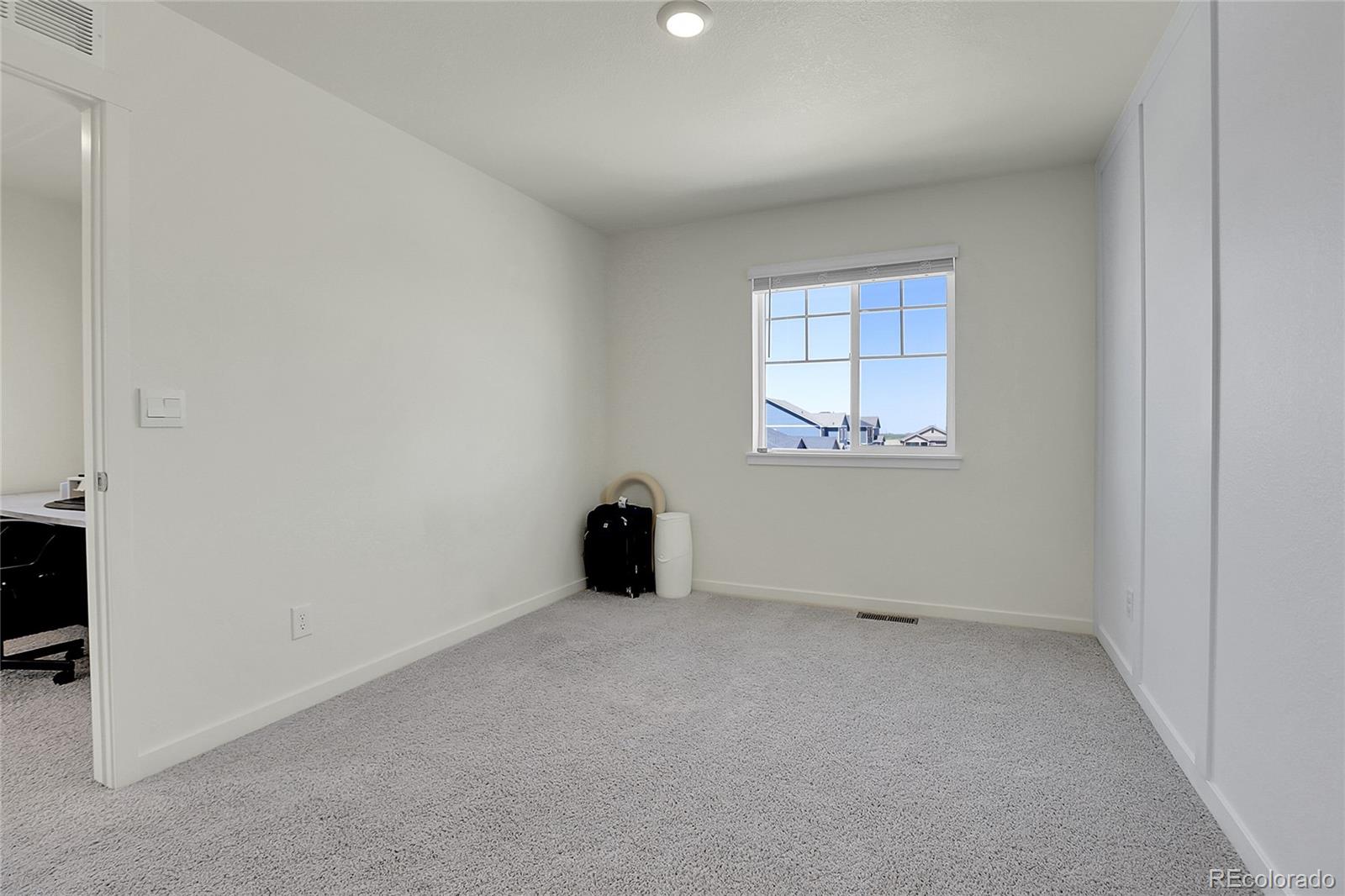 45840 Laceleaf Drive Bennett, CO 80102 - Photo 22 of 43 an empty room with a window