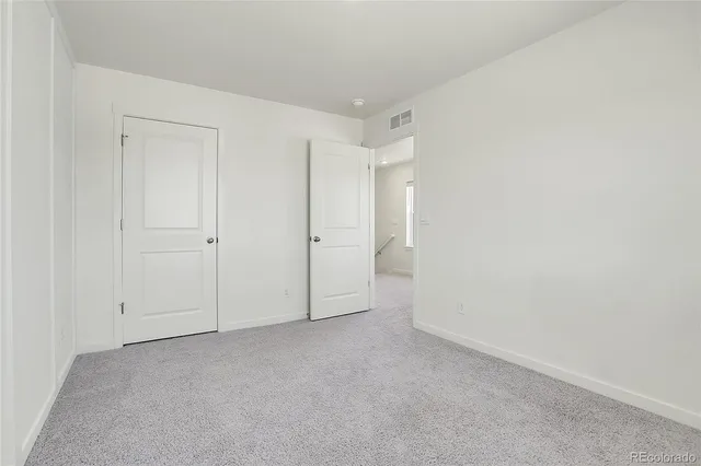 a view of storage and utility room with window