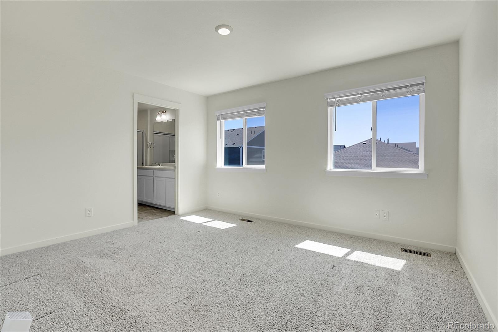 45840 Laceleaf Drive Bennett, CO 80102 - Photo 24 of 43 an empty room with windows
