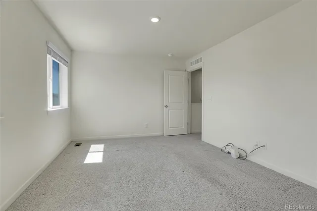 a front view of a house with a yard table and chairs