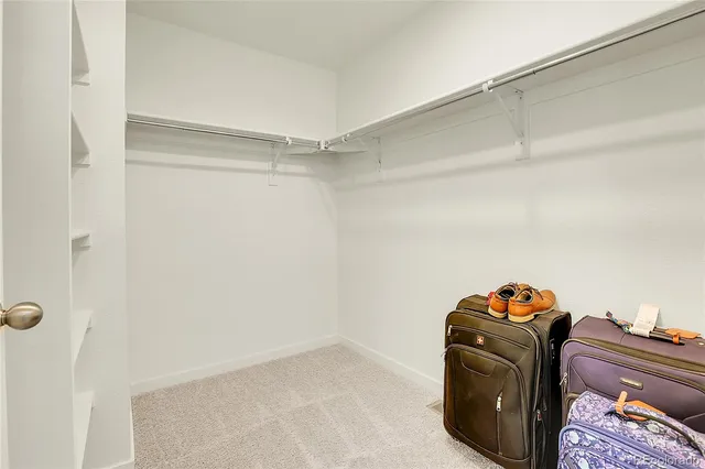 a front view of house with yard barbeque and outdoor seating