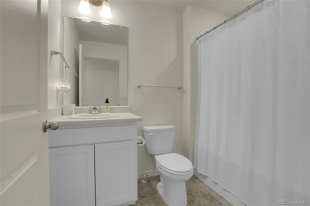 a view of a patio with couches and a table and chairs