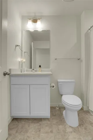 a view of a house with backyard patio and fire pit