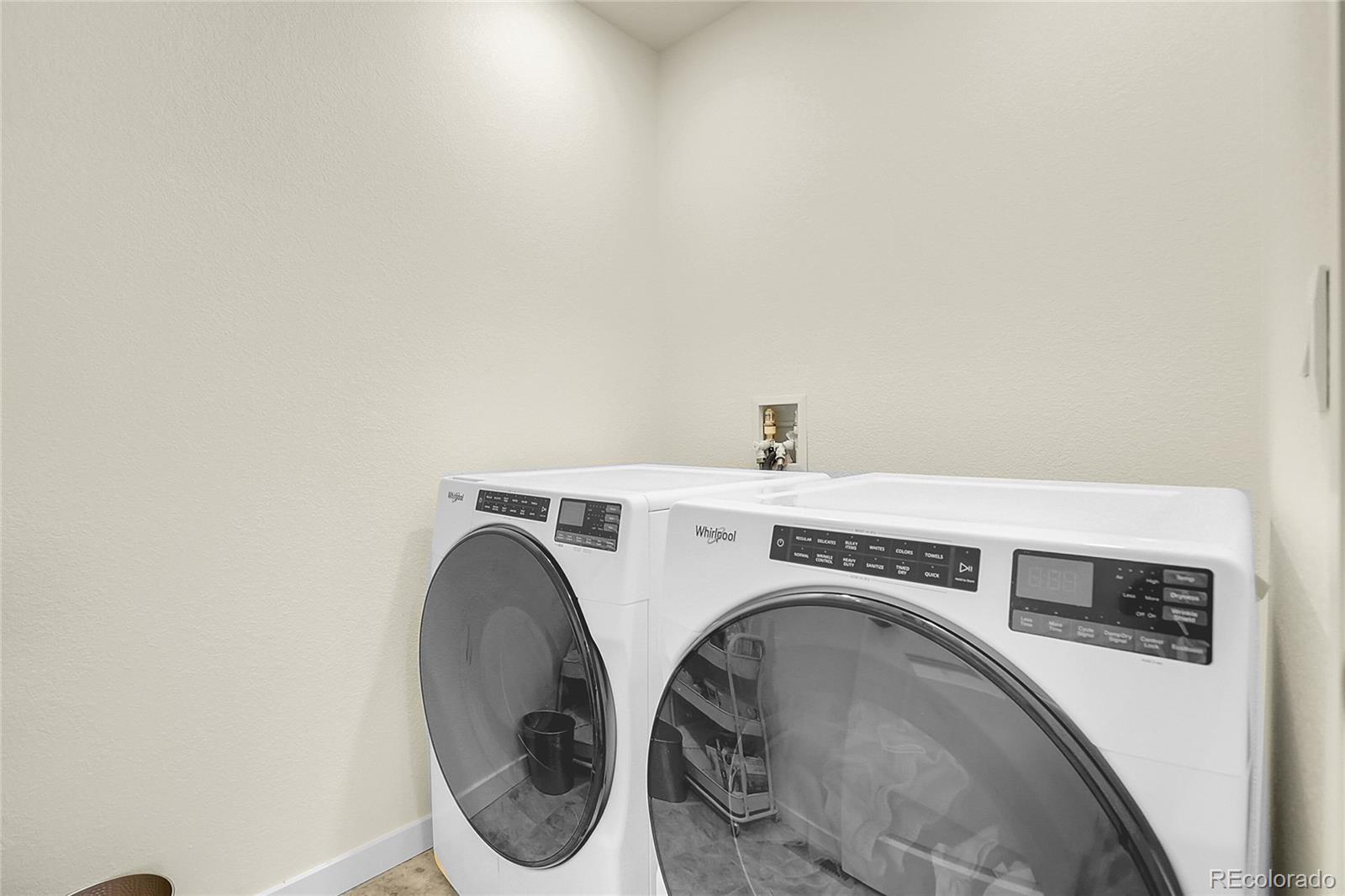 45840 Laceleaf Drive Bennett, CO 80102 - Photo 33 of 43 a utility room with dryer and washer