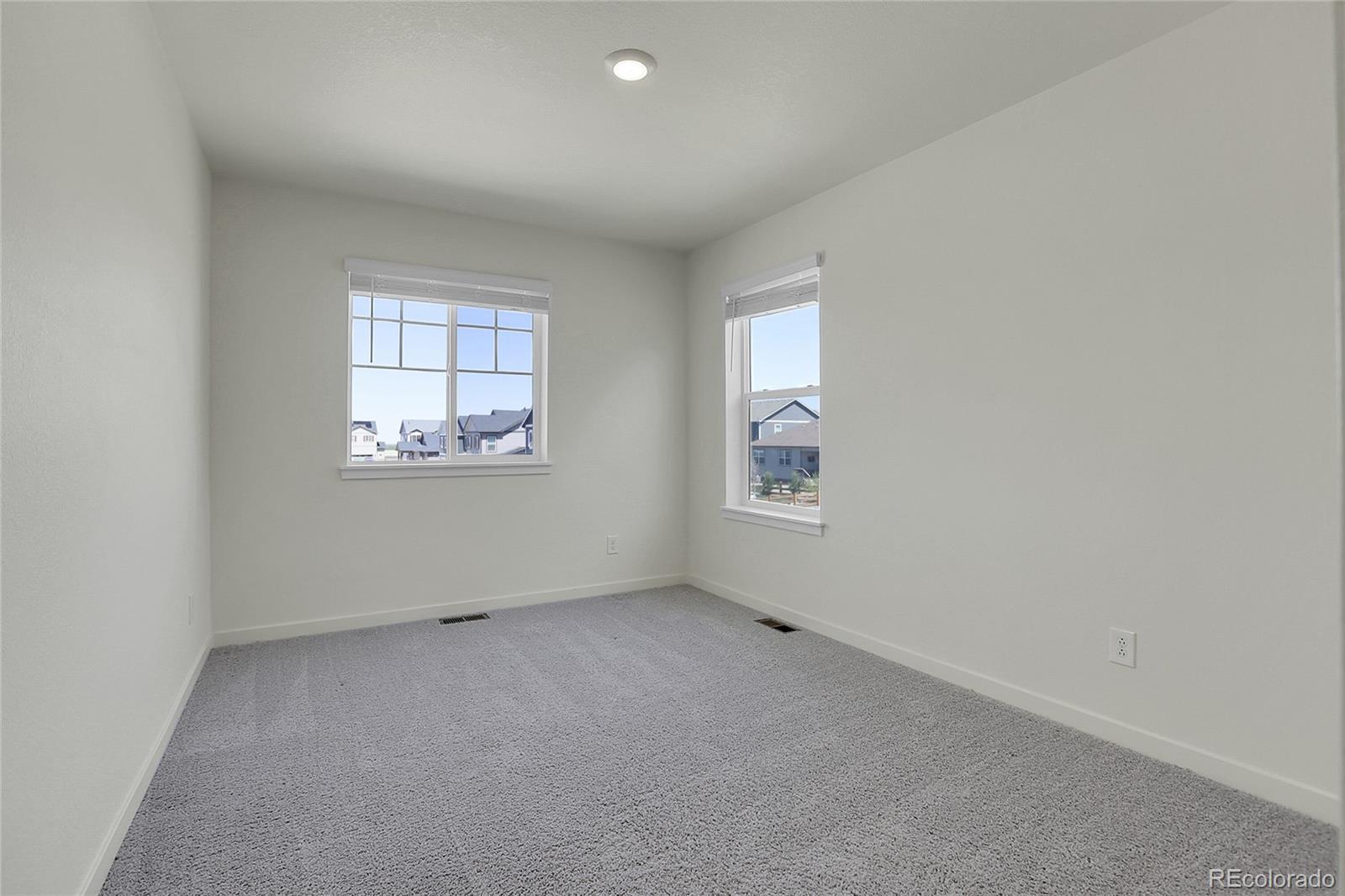 45840 Laceleaf Drive Bennett, CO 80102 - Photo 34 of 43 an empty room with windows