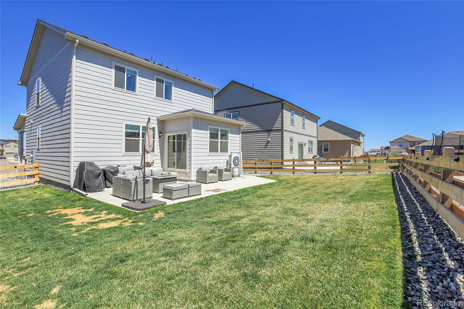 45840 Laceleaf Drive Bennett, CO 80102 - Photo 40 of 43 a front view of house with yard barbeque and outdoor seating