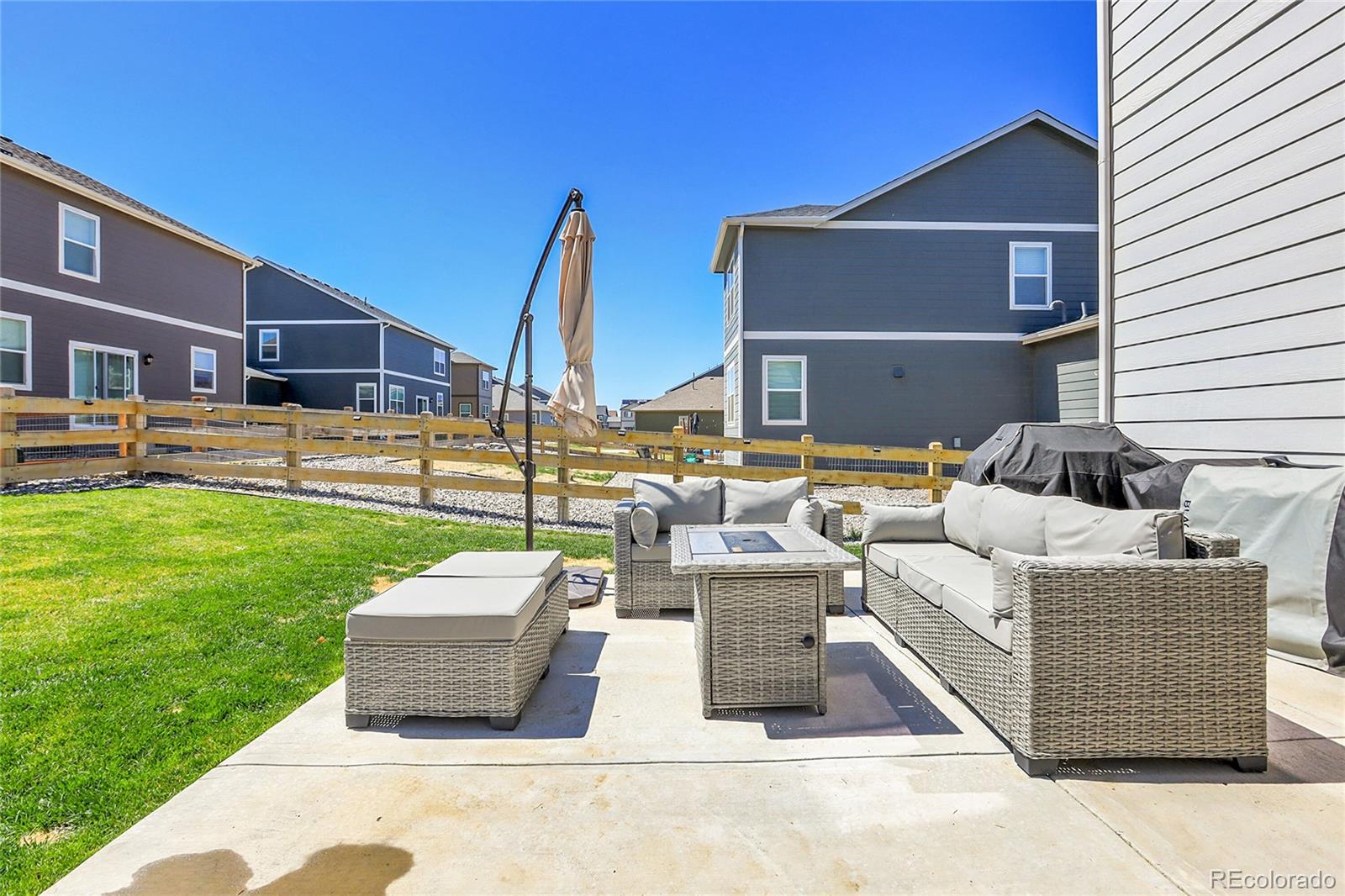 45840 Laceleaf Drive Bennett, CO 80102 - Photo 41 of 43 a view of a patio with couches and a table and chairs
