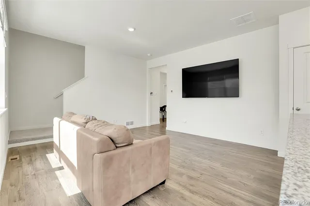 a kitchen with granite countertop cabinets stainless steel appliances and a counter space