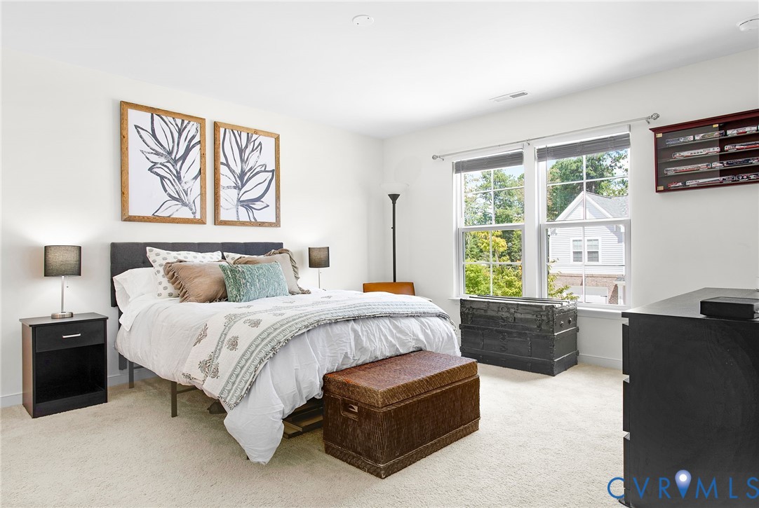 6549 Bolles Landing Court Chester, VA 23831 - Photo 15 of 22 a spacious bedroom with a bed and a couch