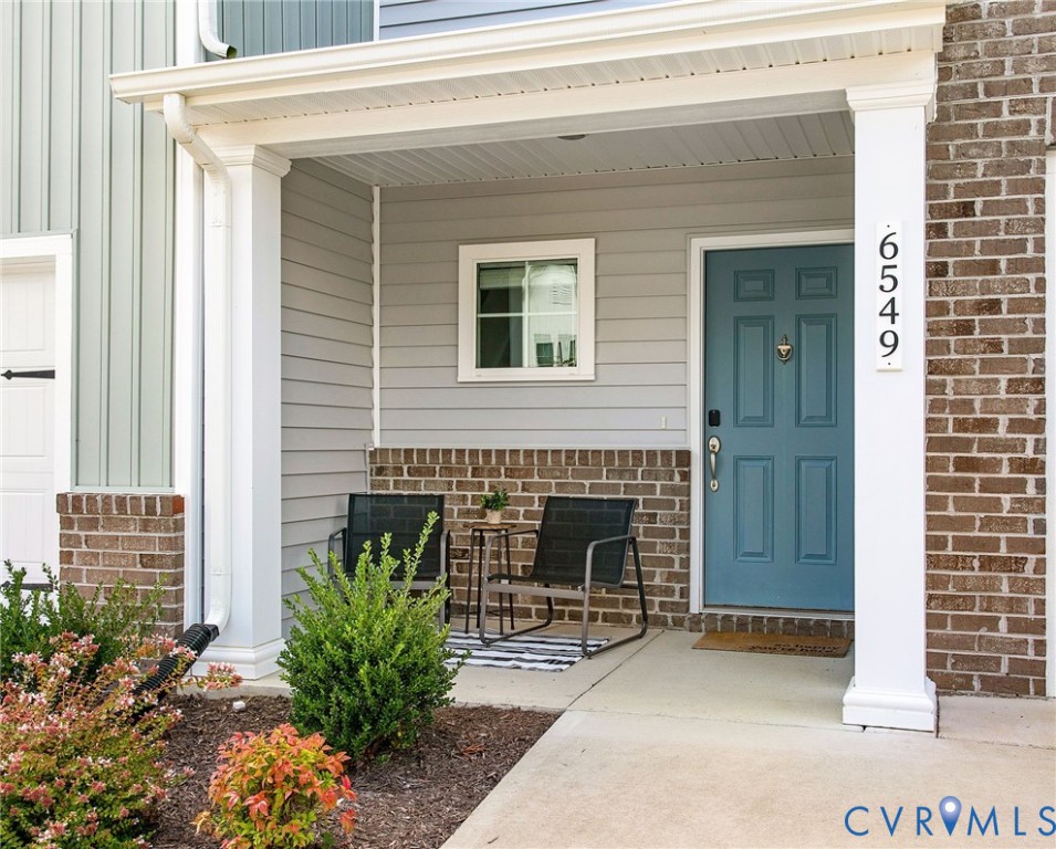 6549 Bolles Landing Court Chester, VA 23831 - Photo 3 of 22 a front view of a house with garden