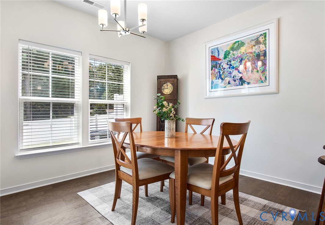 6549 Bolles Landing Court Chester, VA 23831 - Photo 9 of 22 a view of a dining room with furniture window and wooden floor