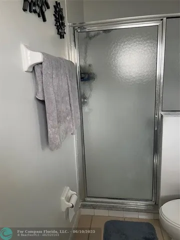 a bathroom with a granite countertop sink and vanity