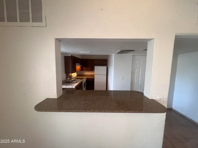 a view of kitchen and living room