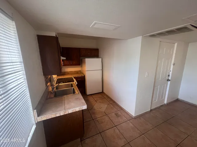 a kitchen with a stove and a sink