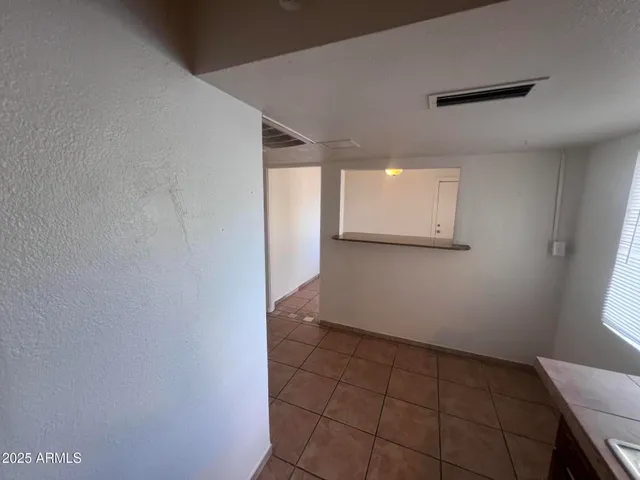 a kitchen with a sink stove top oven and cabinets
