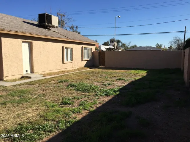 a view of a backyard of the house