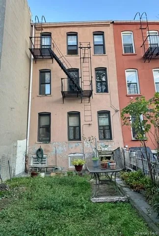 a house that has couches in front of it