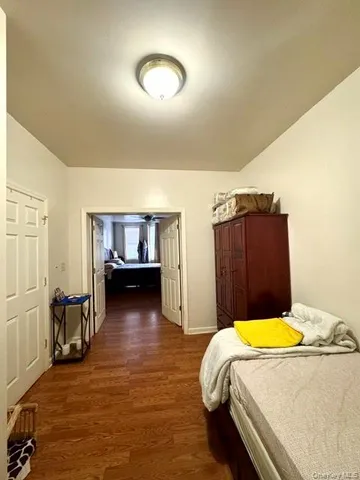 a bedroom with a bed and dresser