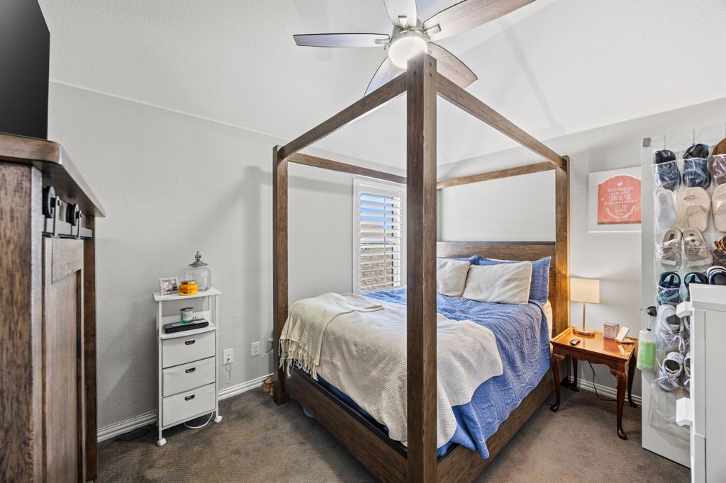 813 Pier Street Little Elm, TX 76227 - Photo 13 of 16 a bedroom with a bed and a window