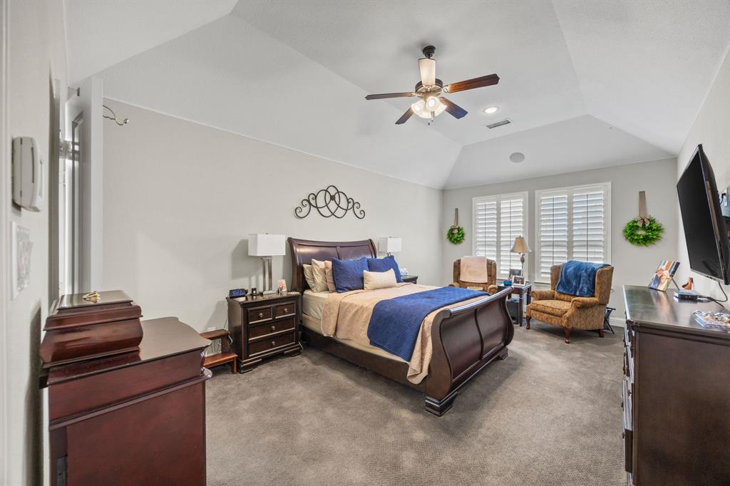 813 Pier Street Little Elm, TX 76227 - Photo 8 of 16 a bed room with bed and window