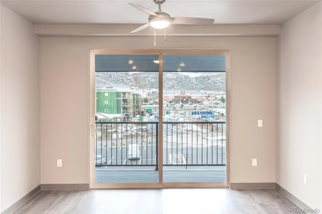 a view of empty room with floor to ceiling window
