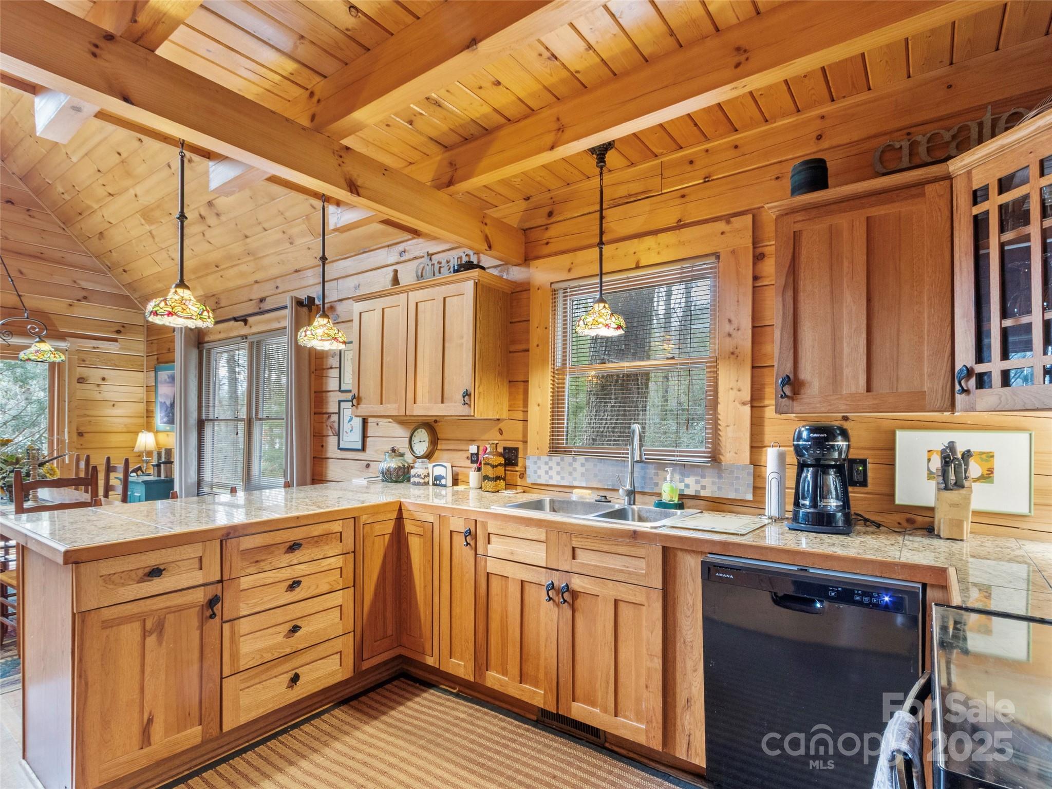 741 South Toe River Road Burnsville, NC 28714 - Photo 11 of 41 a large kitchen with a large window