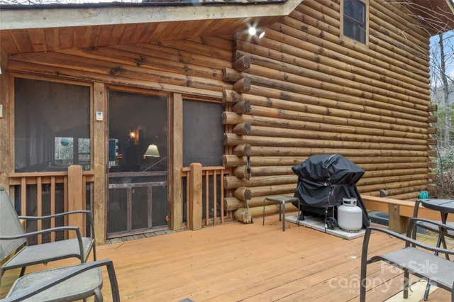 a view of a chair and tables in the patio