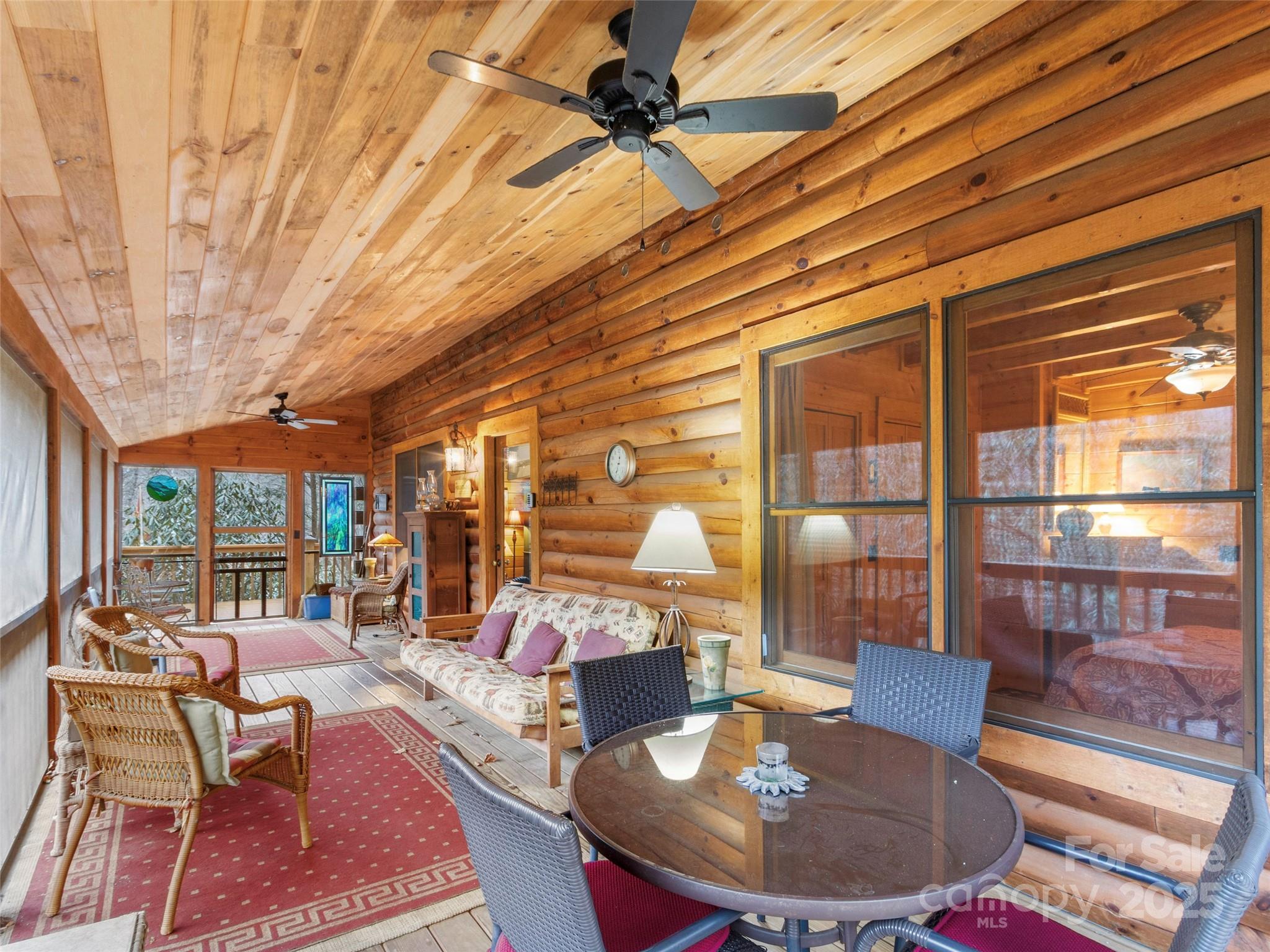 741 South Toe River Road Burnsville, NC 28714 - Photo 19 of 41 a living room with furniture a lamp and a table
