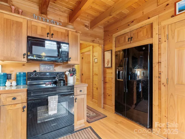 a kitchen with stainless steel appliances granite countertop a stove and a refrigerator