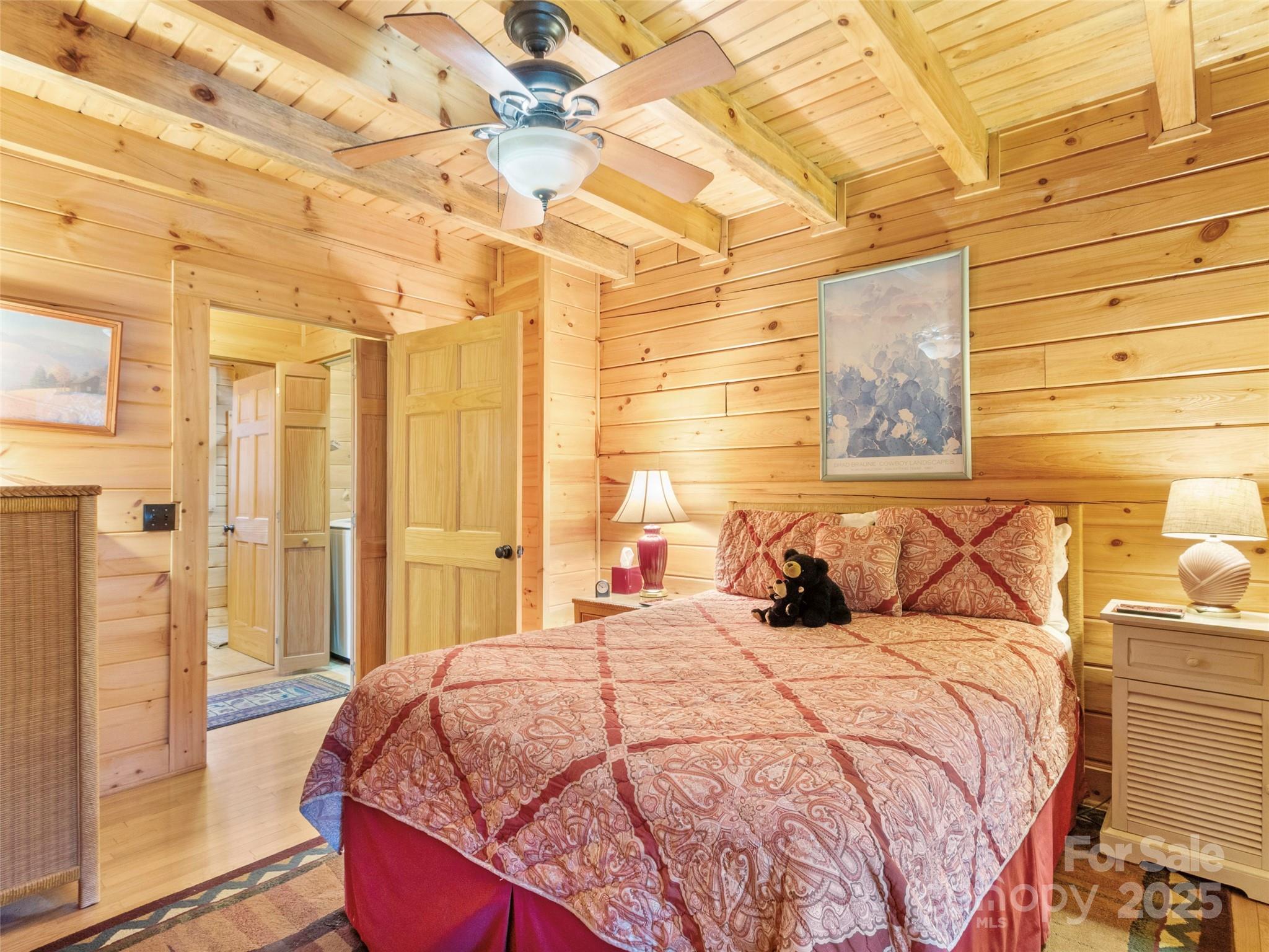 741 South Toe River Road Burnsville, NC 28714 - Photo 26 of 41 a bedroom with a bed and a window