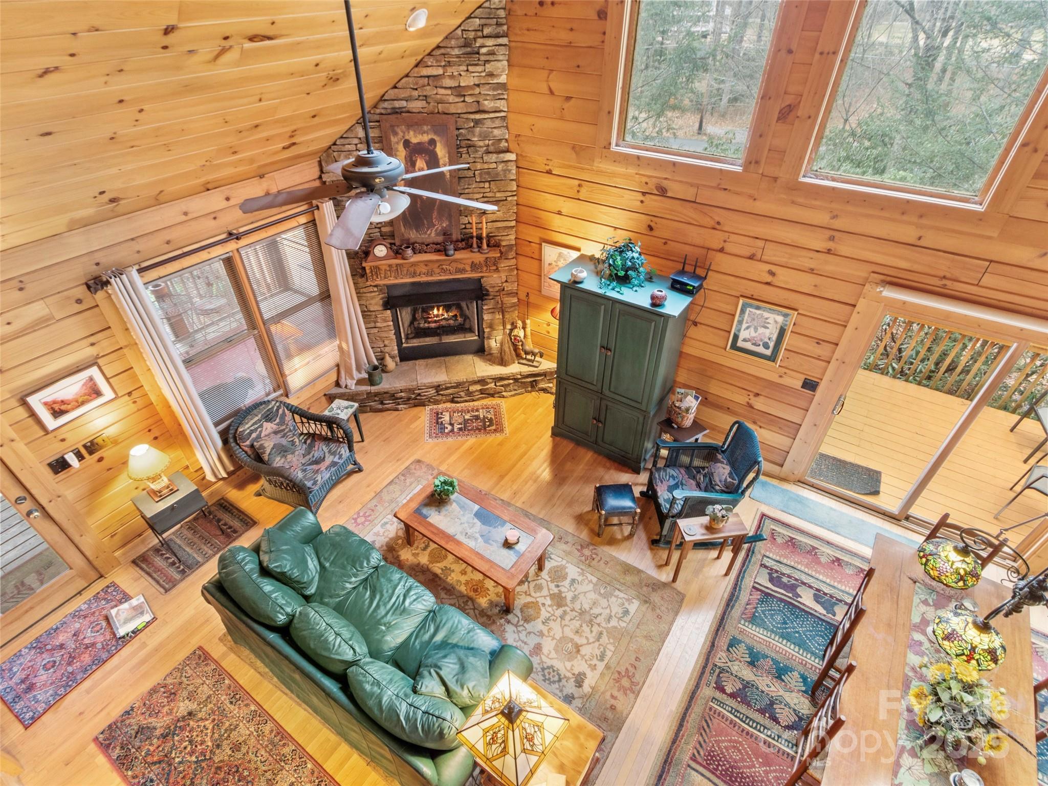 741 South Toe River Road Burnsville, NC 28714 - Photo 28 of 41 a view of a patio with table and chairs with wooden floor