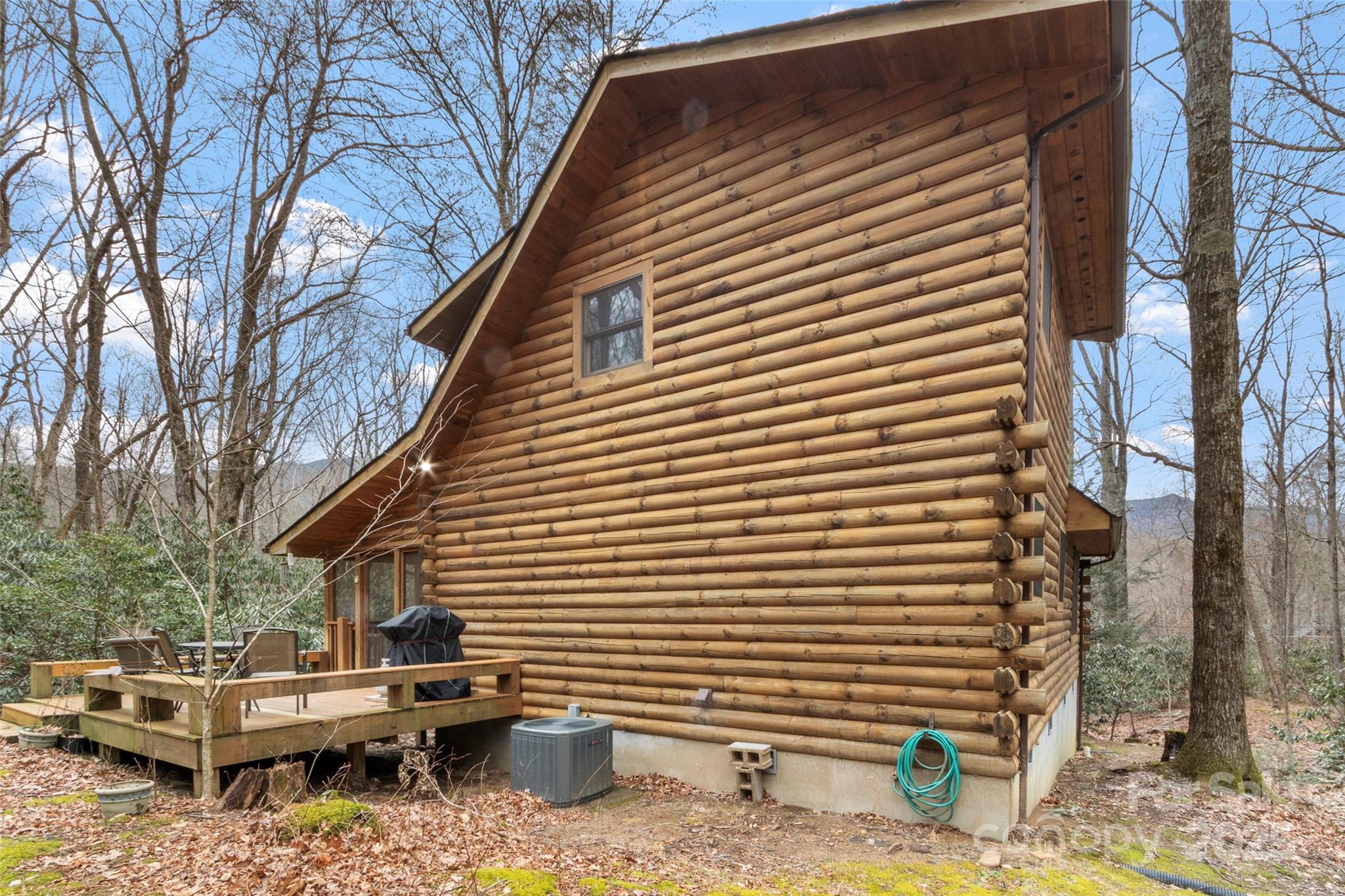 741 South Toe River Road Burnsville, NC 28714 - Photo 40 of 41 a view of backyard of house with a barbeque and wooden fence