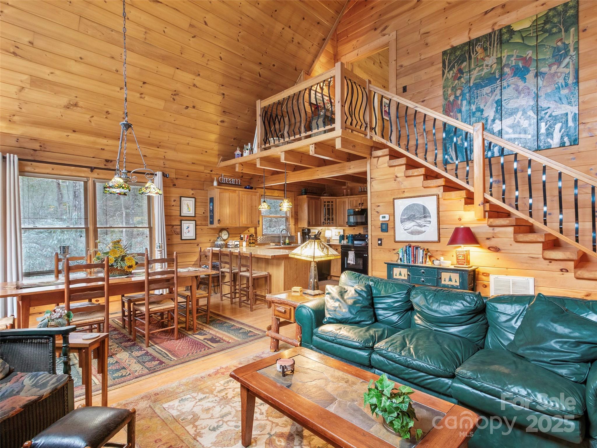 741 South Toe River Road Burnsville, NC 28714 - Photo 5 of 41 a view of a chairs and table in the patio