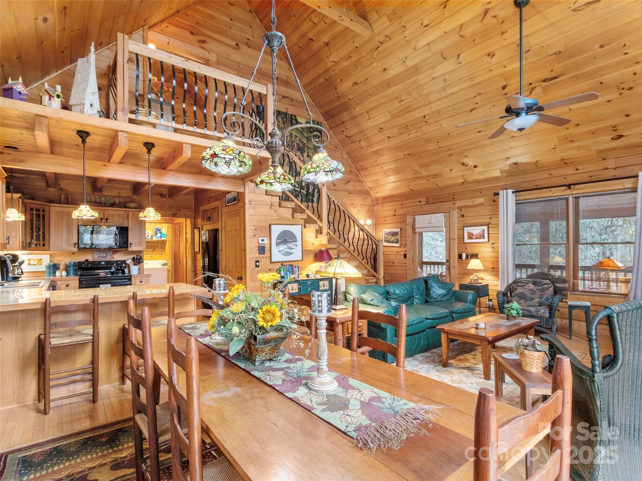 741 South Toe River Road Burnsville, NC 28714 - Photo 7 of 41 a view of a building with outdoor seating