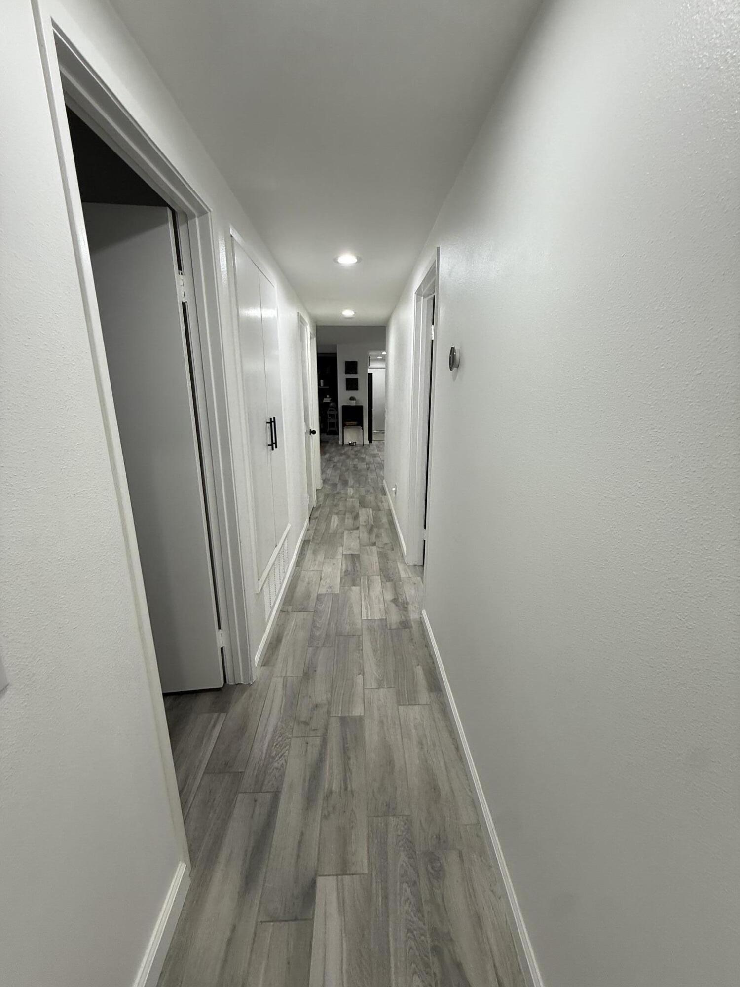 37081 Palmdale Road Rancho Mirage, CA 92270 - Photo 23 of 46 a view of hallway with wooden floor