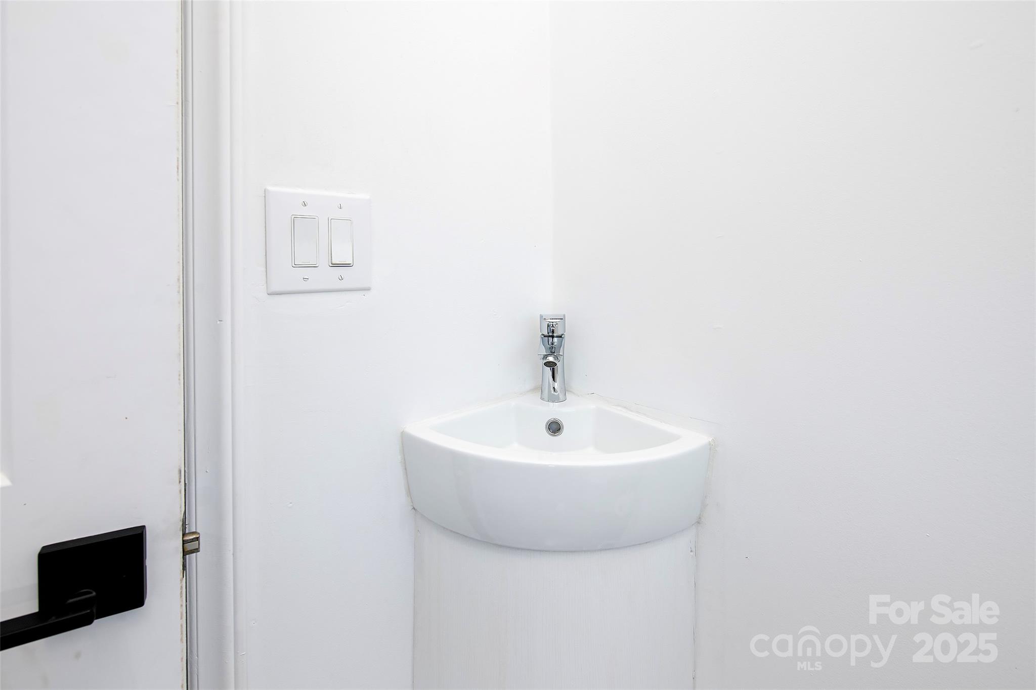 1615 Stack Road Monroe, NC 28112 - Photo 24 of 43 a bathroom with a sink a mirror and vanity