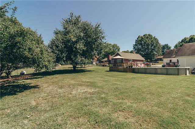 Over a half acre of land backing up to a wooden area! There is an underground fence wire already installed, you just need the box and collar! 
