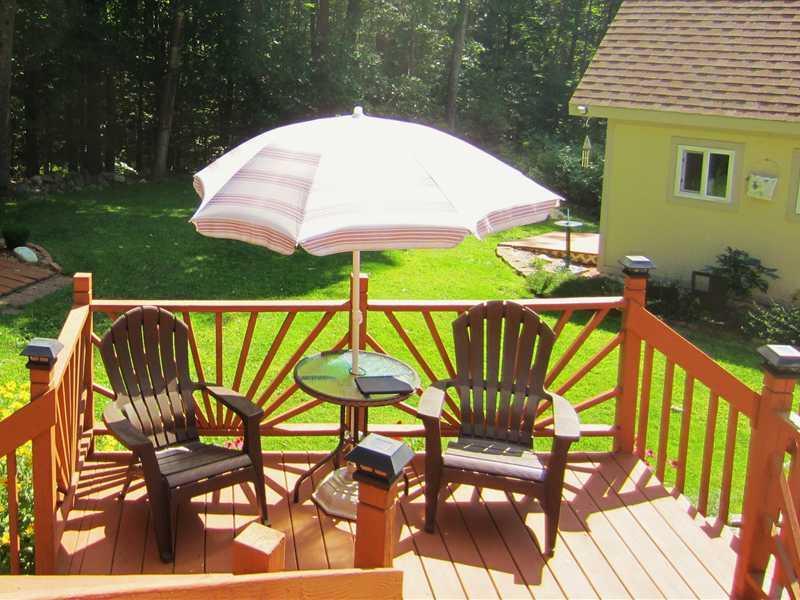 5 Shaker Woods Road Raymond, ME 04071 - Photo 17 of 28 Exterior Back. The Multi level deck...