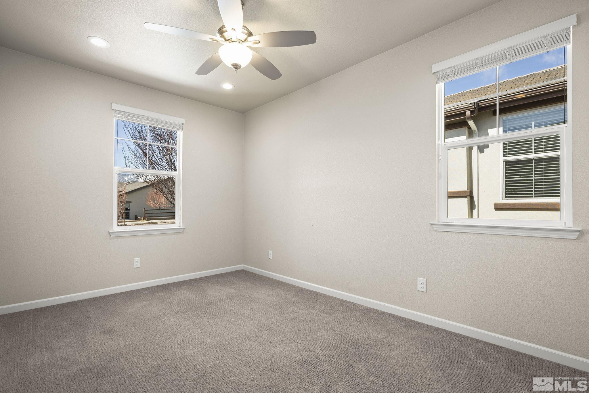 966 Callaway Trail Reno, NV 89523 - Photo 11 of 33 an empty room with windows and fan