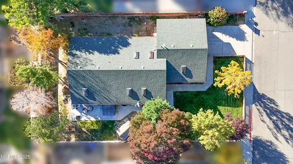 a view of a patio with table and chairs