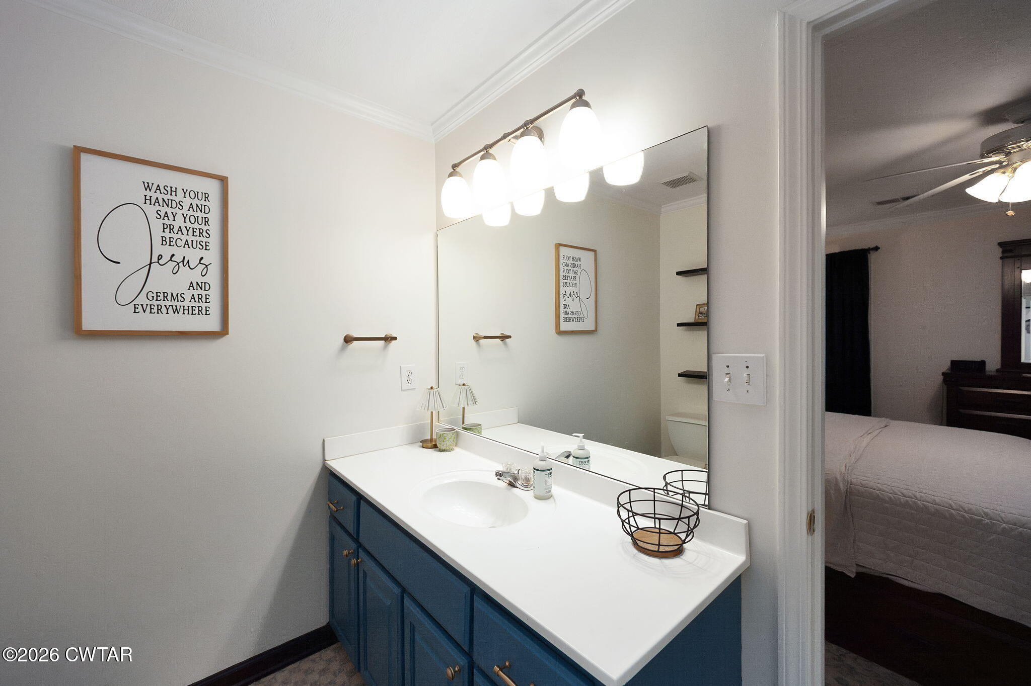 80 Rooker Drive Jackson, TN 38305 - Photo 16 of 30 a bathroom with a sink and a mirror