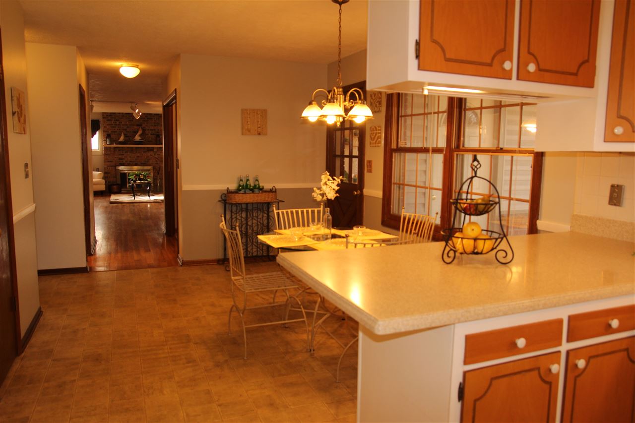 4972 Brookview Road Rockford, IL 61107 - Photo 11 of 22 a view of a dining room with furniture and chandelier