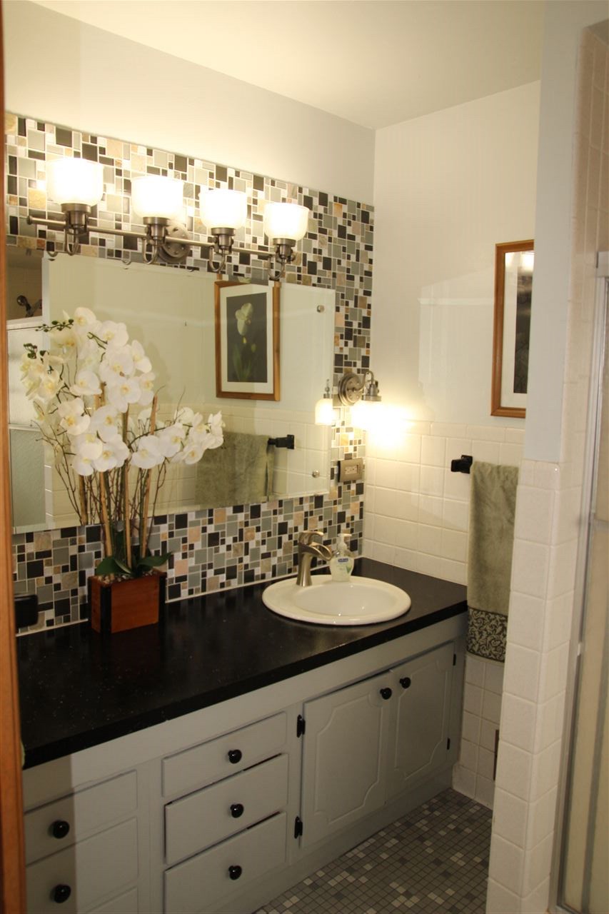 4972 Brookview Road Rockford, IL 61107 - Photo 15 of 22 a bathroom with a sink and a mirror