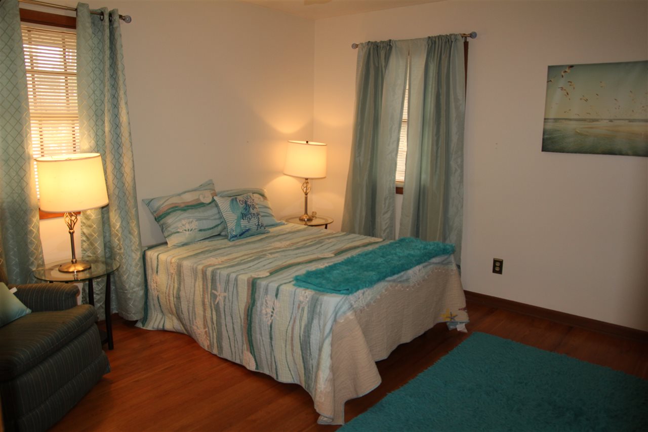 4972 Brookview Road Rockford, IL 61107 - Photo 18 of 22 a bedroom with a bed and a lamp