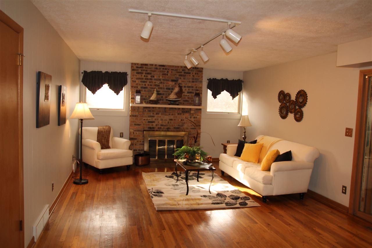 4972 Brookview Road Rockford, IL 61107 - Photo 5 of 22 a living room with furniture and a fireplace