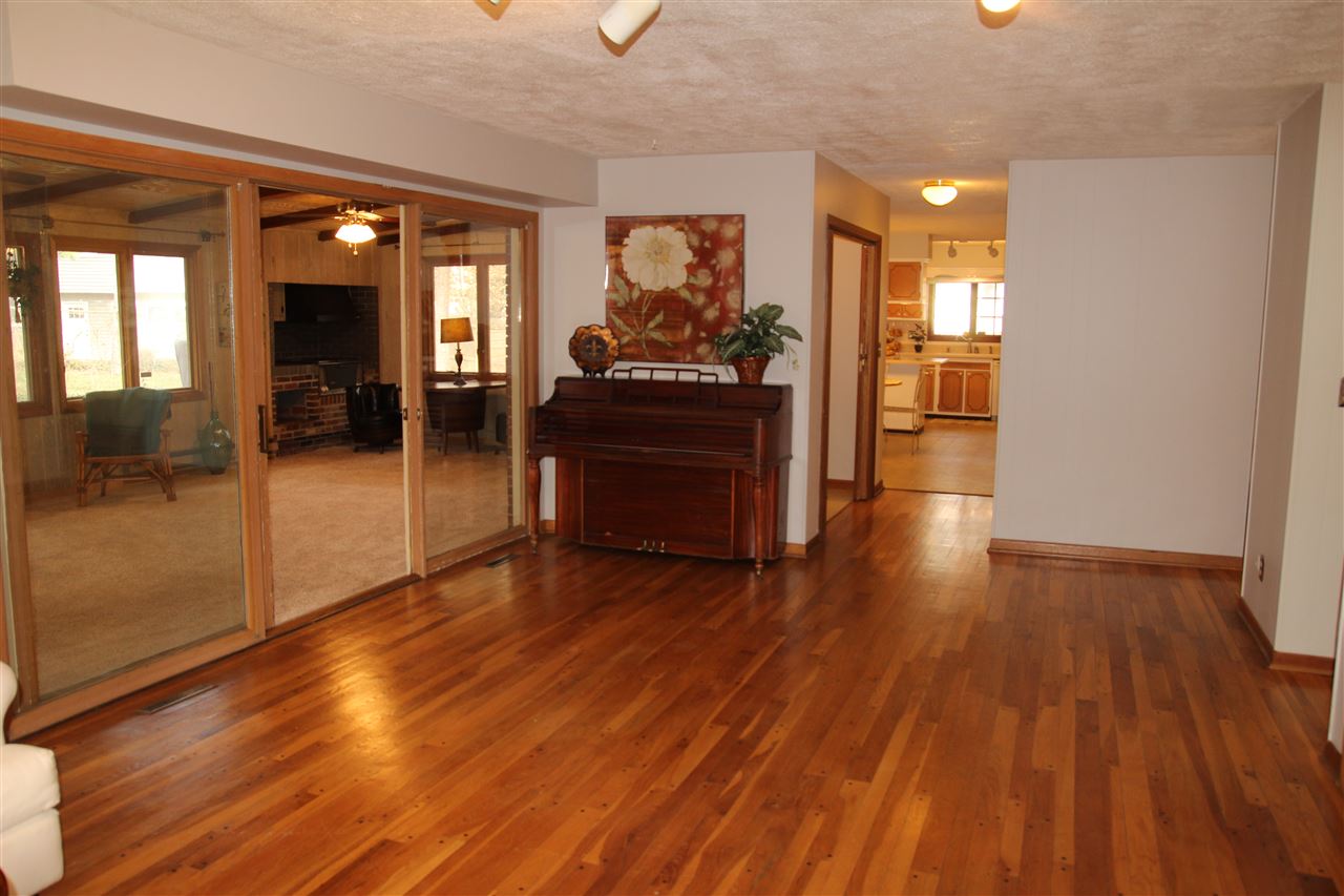 4972 Brookview Road Rockford, IL 61107 - Photo 6 of 22 a view of a hallway view with wooden floor and furniture