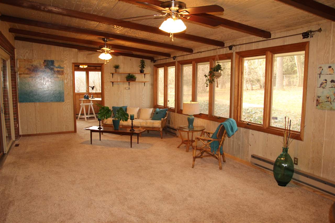4972 Brookview Road Rockford, IL 61107 - Photo 7 of 22 a living room with furniture and a flat screen tv