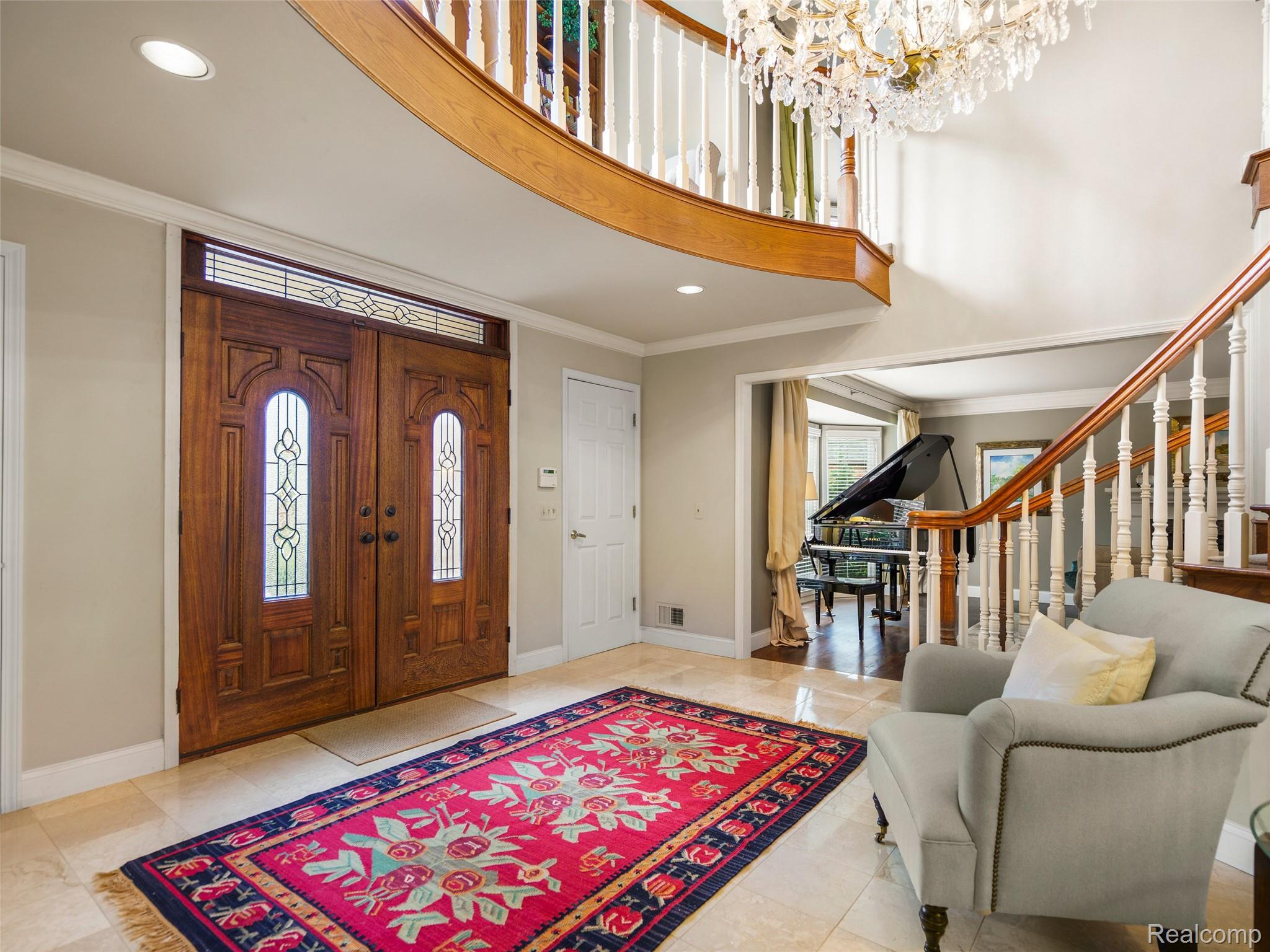 5724 Murfield Drive Rochester, MI 48306 - Photo 34 of 99 Entrance foyer featuring recessed lighting, crown molding, stairway, a towering ceiling, and light tile patterned flooring